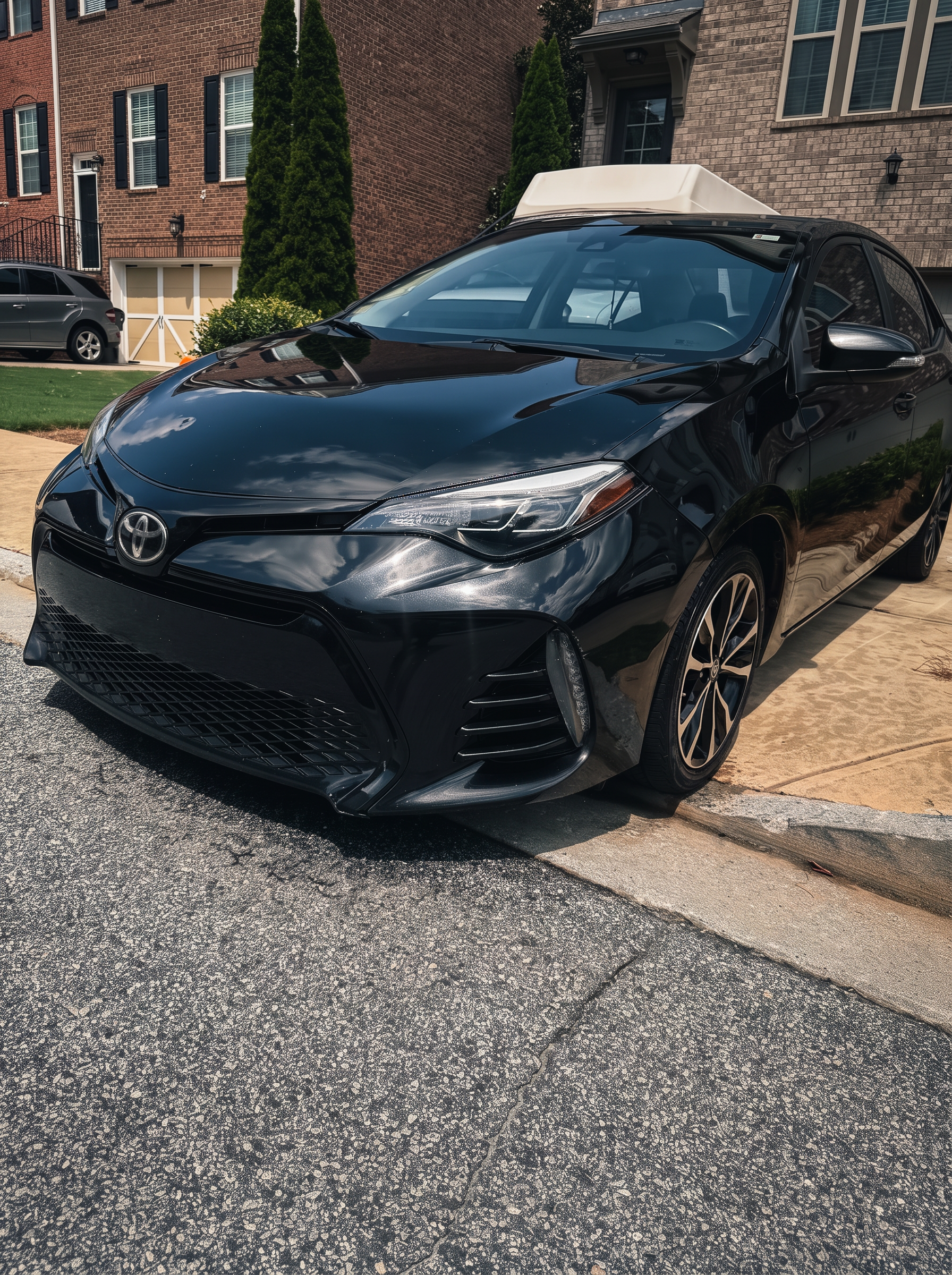 Glossy black Toyota Corolla after one-step paint correction
